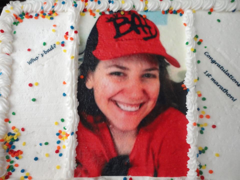 cake celebrating Aurora's first marathon. (Her face is on the cake)