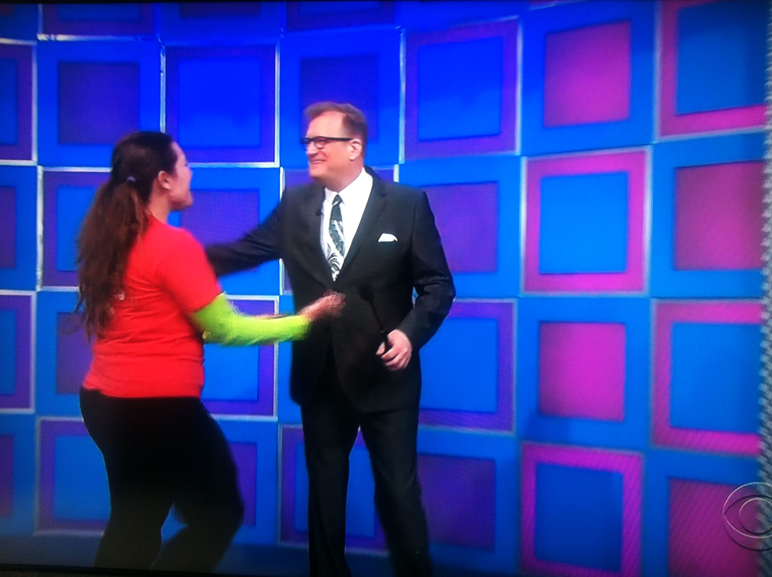 Aurora De Lucia going for a hug with Drew Carey on The Price is Right