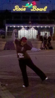 Aurora happily posing in the dark in the middle of the night/morning outside the Rose Bowl before the half marathon 2012