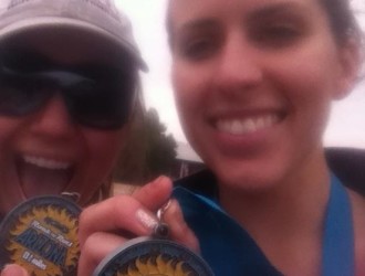 Aurora and her friend Taylor in a close-up posing with their medals after Rock 'n' Roll AZ 2012
