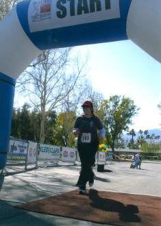 Aurora running across the finish line of the Palm Springs half marathon 2012