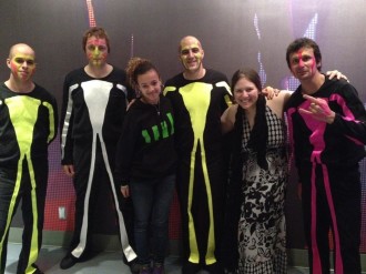 Aurora and Marlee posing with some performers after the Blue Man Group show in Orlando