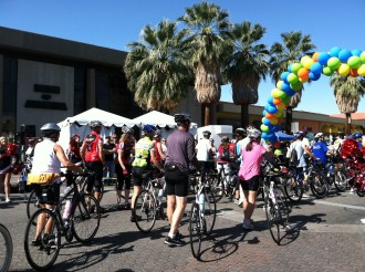 cyclists walking their bikes into the finish of the Palm Springs 2012 bike ride