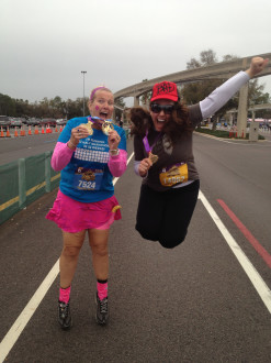 Aurora and Wendy jumping in the air at the end of the Disney Princess half marathon 2012