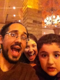 silly selfie of Aurora, her friend, and his young relative at dinner