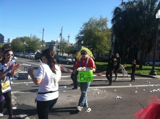 a guy in a funny hat with a makeshift beer station during Rock 'n' Roll New Orleans half marathon 2012