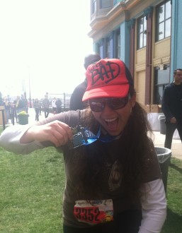 Aurora posing with her April Fools Atlantic City half marathon medal 2012 