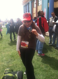 Aurora sort of leaning back with her April Fools Atlantic City 2012 half marathon medal