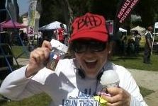 Aurora De Lucia at the finish of A Run Through the Redlands half marathon 2012, holding her snowcone and medal