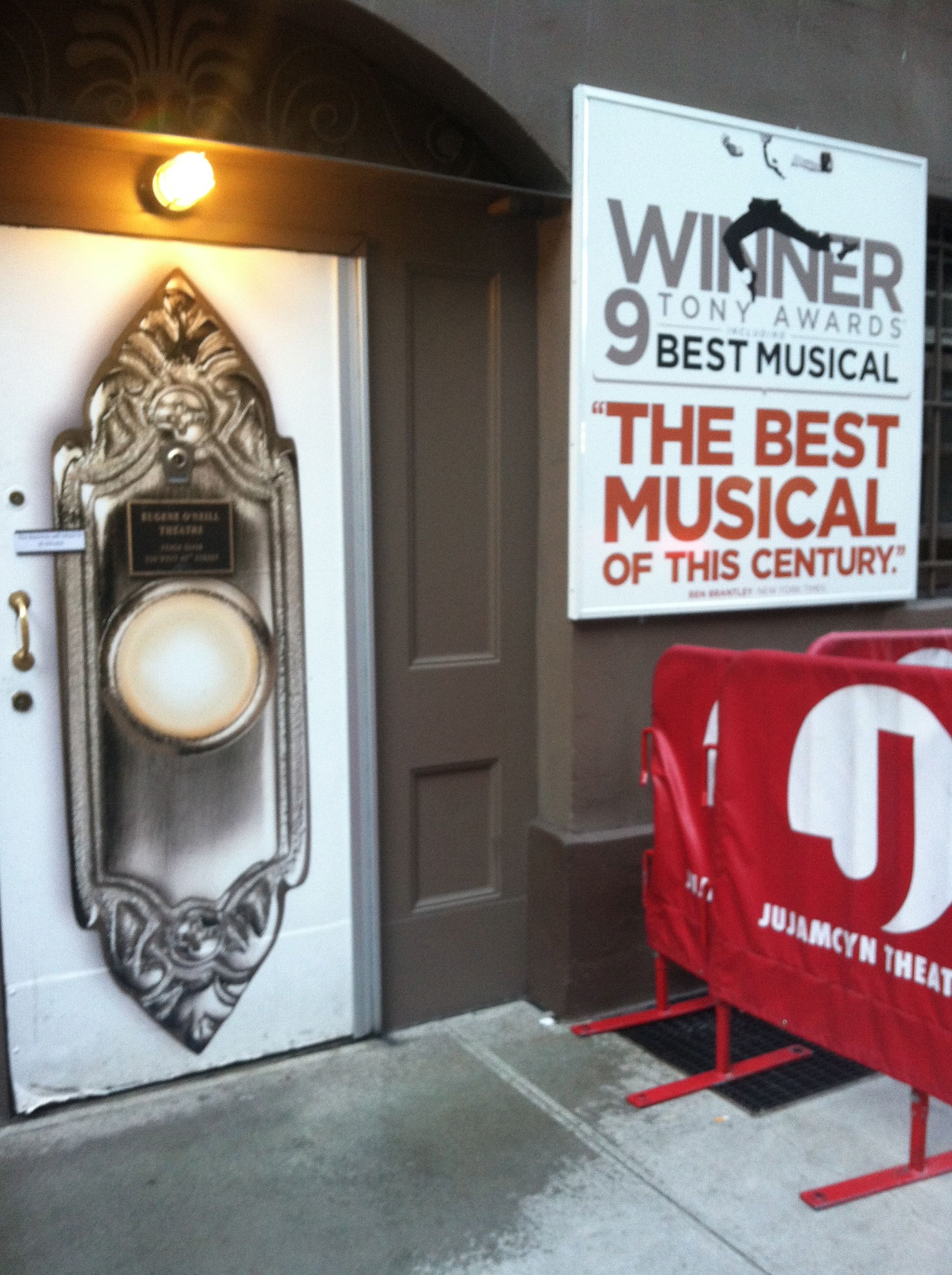 big doorbell painted on the stage door (and the 9 Tony winning sign) at The Book of Mormon the musical at the Eugene O'Neil Theatre
