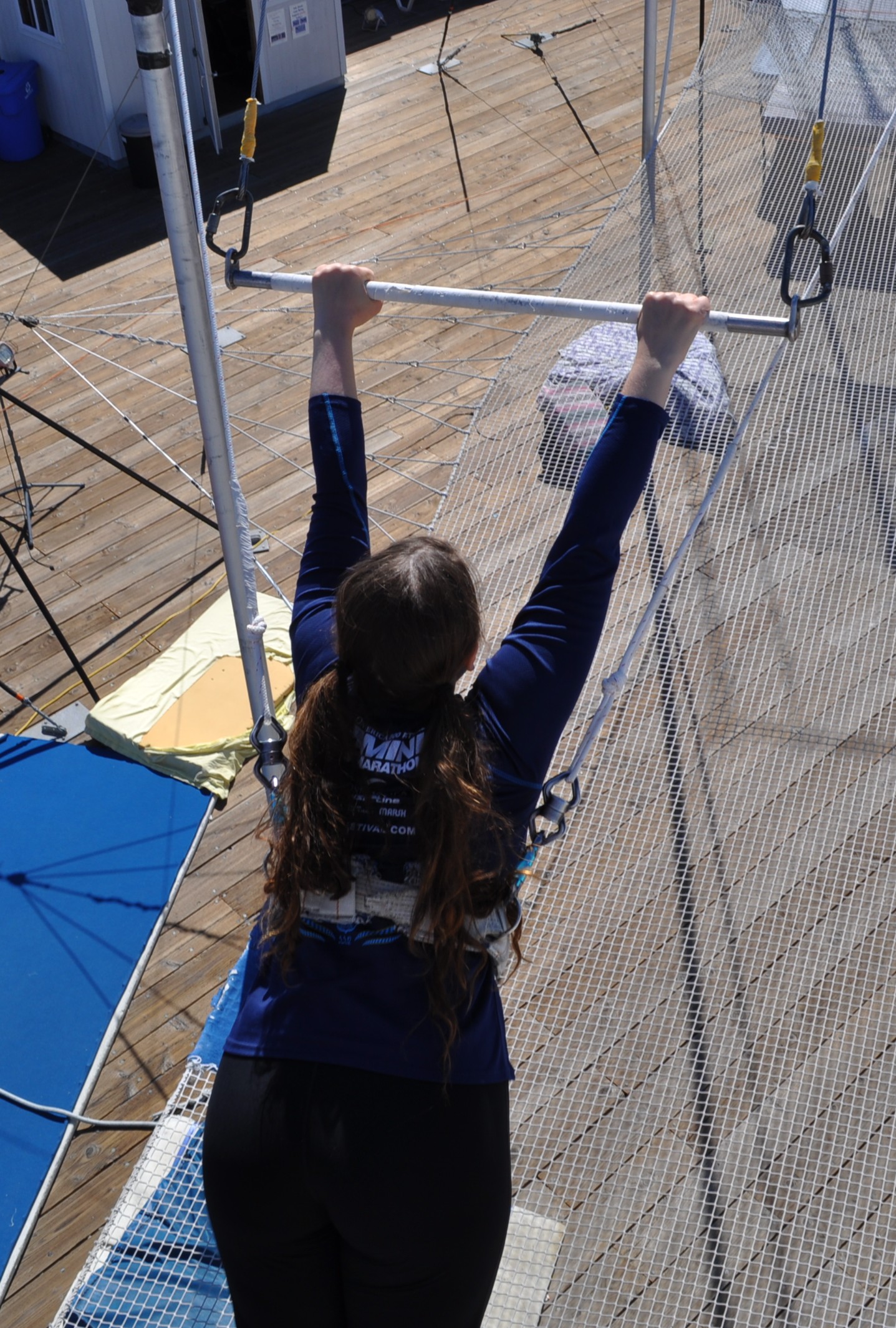 Aurora De Lucia prepping for flying trapeze back view