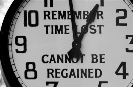 clock showing the quote - remember time lost cannot be regained