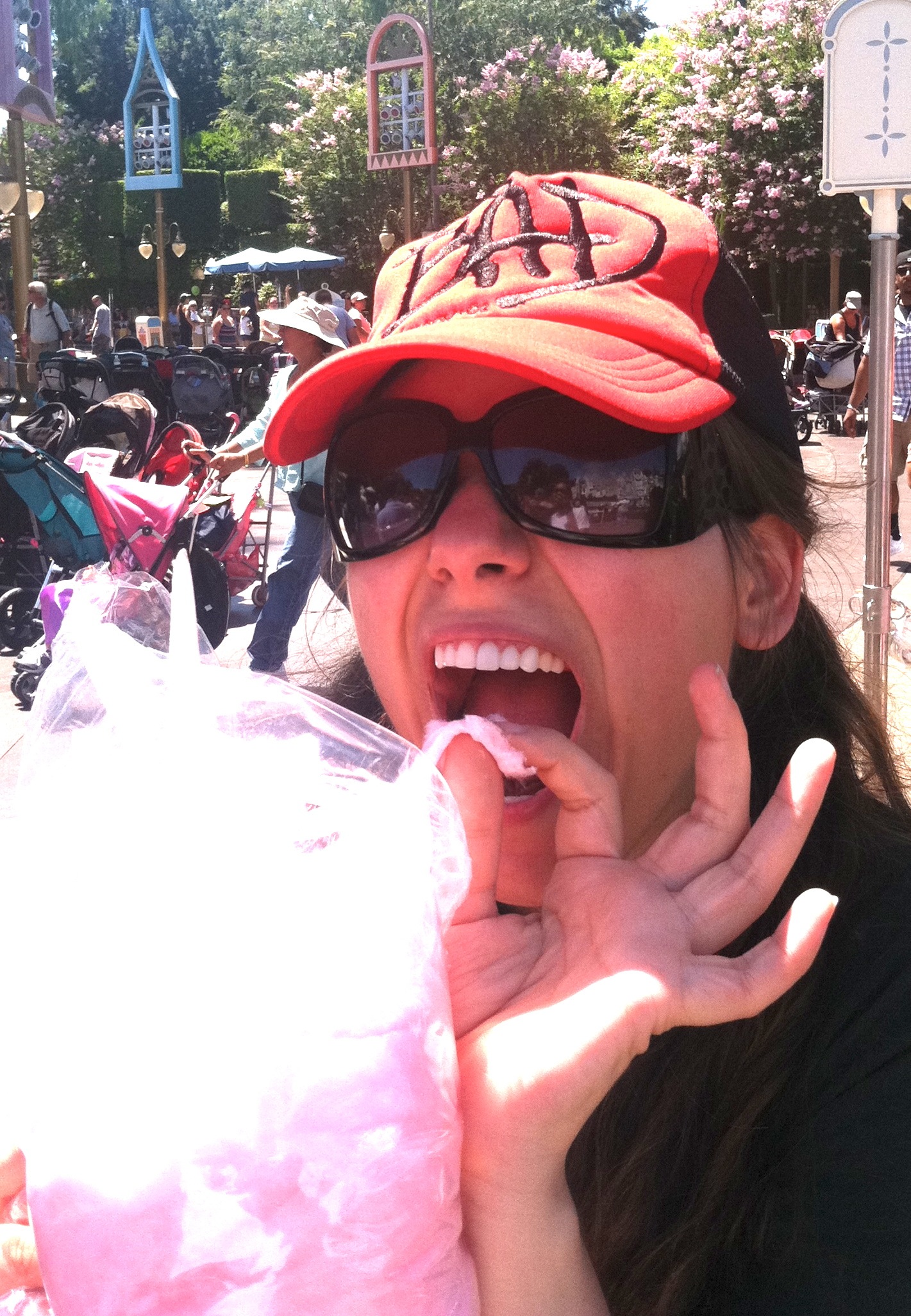 Aurora eating cotton candy at Disneyland
