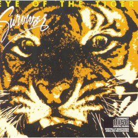 close up on a tiger's face on the front of Survivor's album cover for "Eye of the Tiger"
