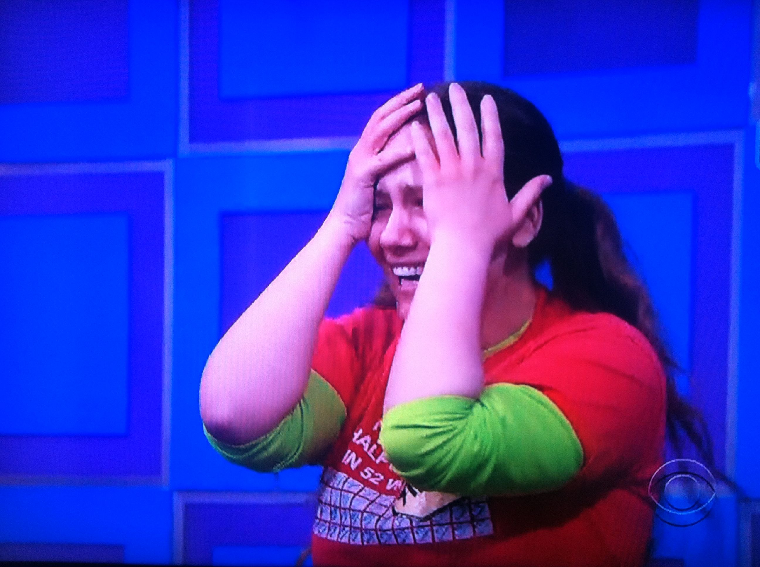 Aurora with her hands in front of her face on The Price is Right
