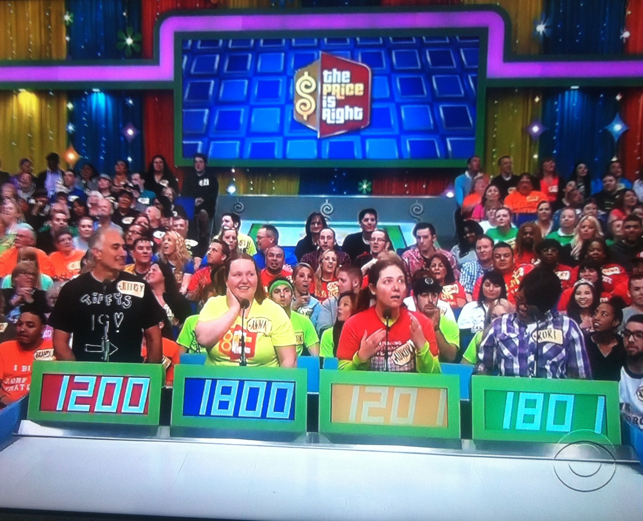 Aurora behind her podium in disbelief that she's the next person up to contestant's row on The Price is Right