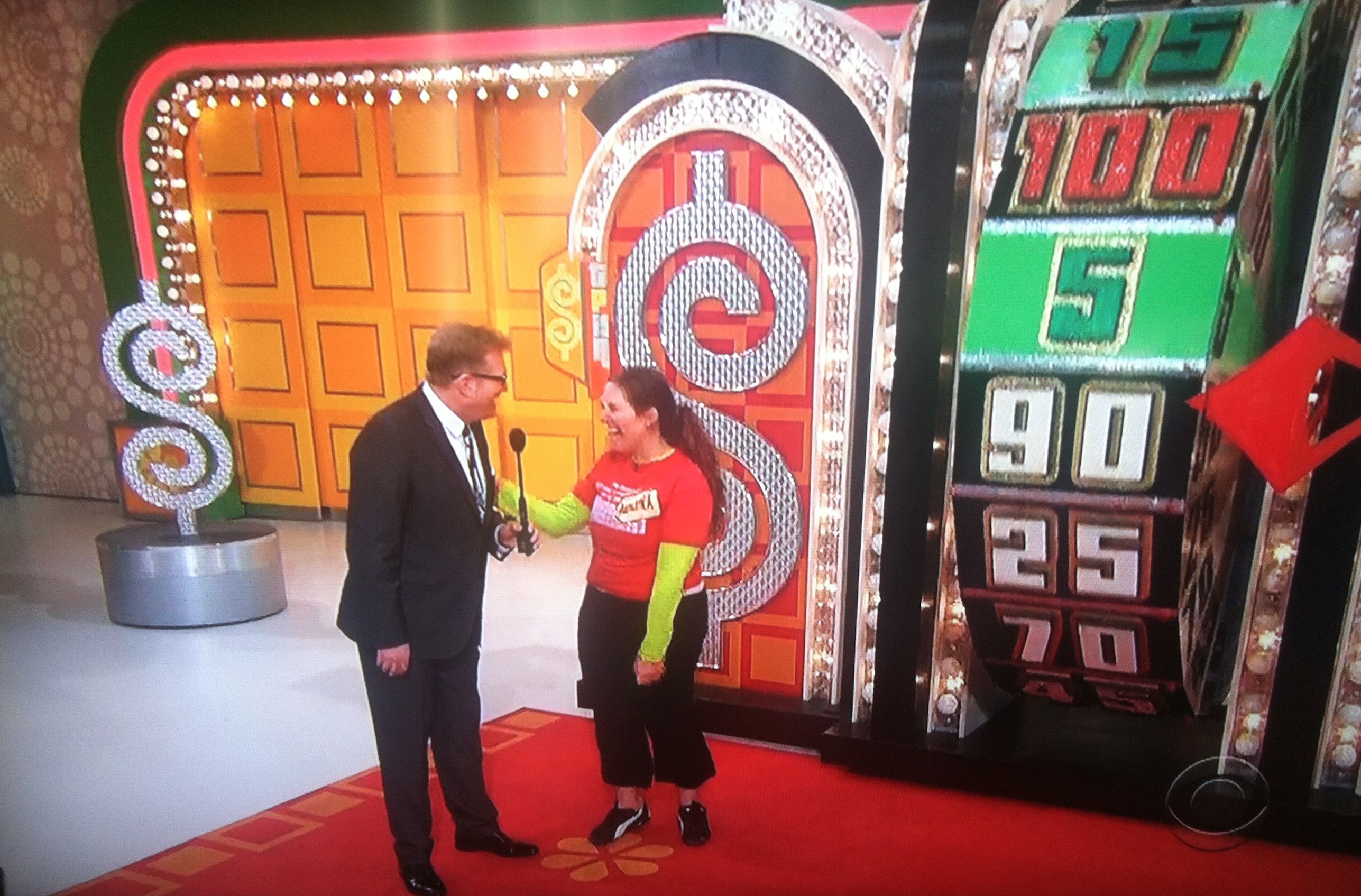 Aurora De Lucia having fun with Drew Carey at The Price is Right wheel