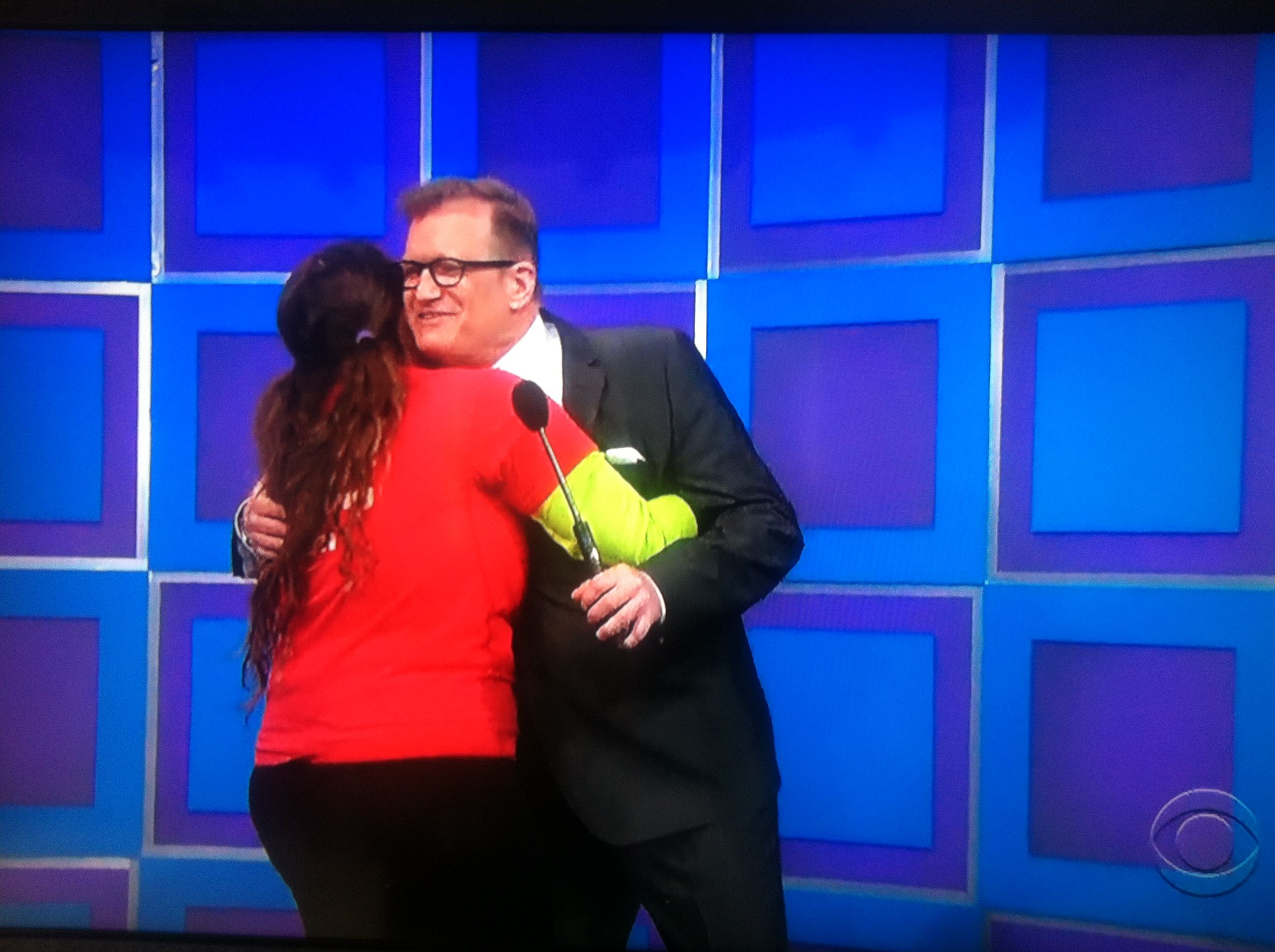 Aurora De Lucia hugging Drew Carey on The Price is Right stage