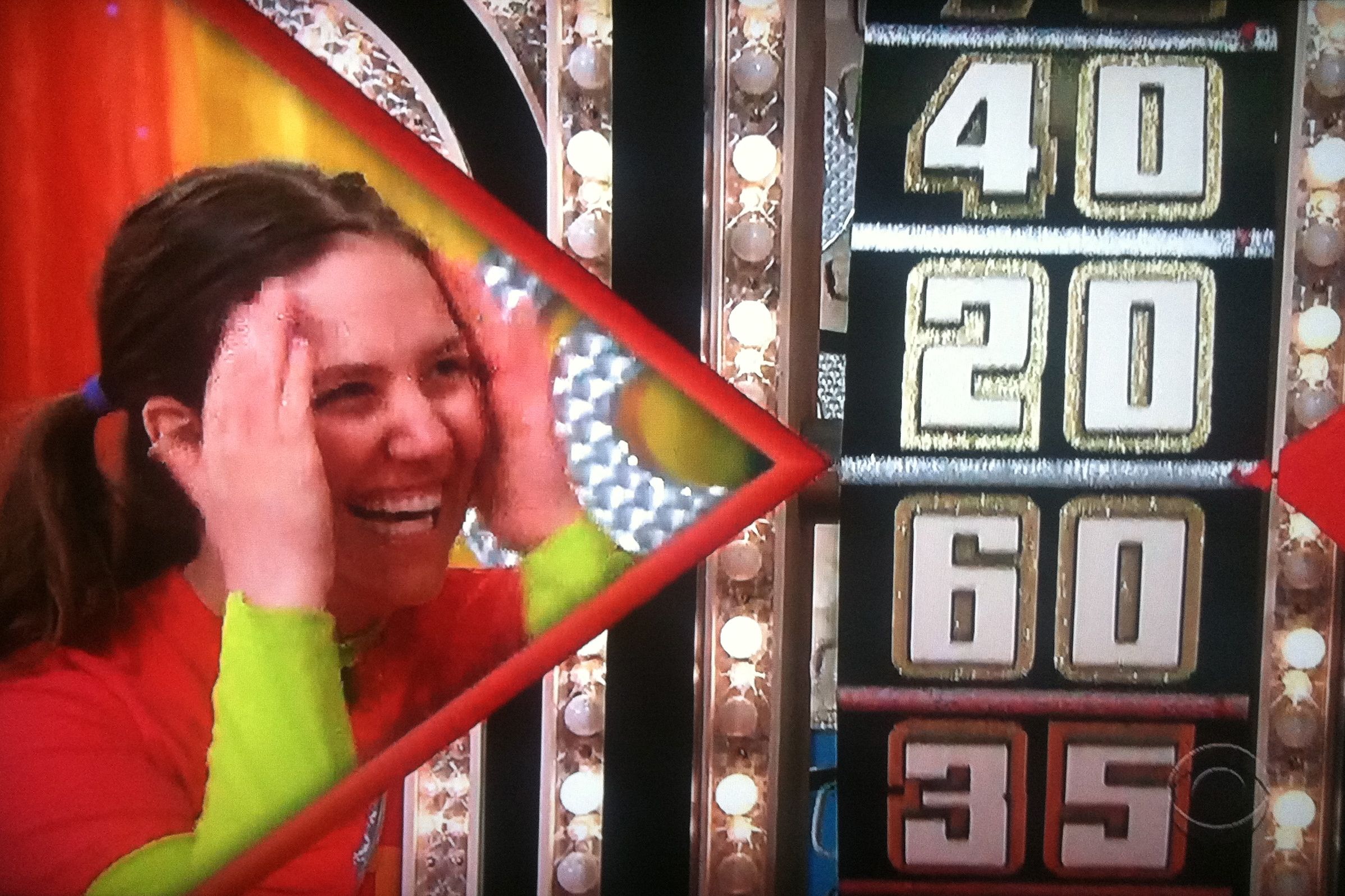 Aurora De Lucia smiling while spinning the big wheel on The Price is Right