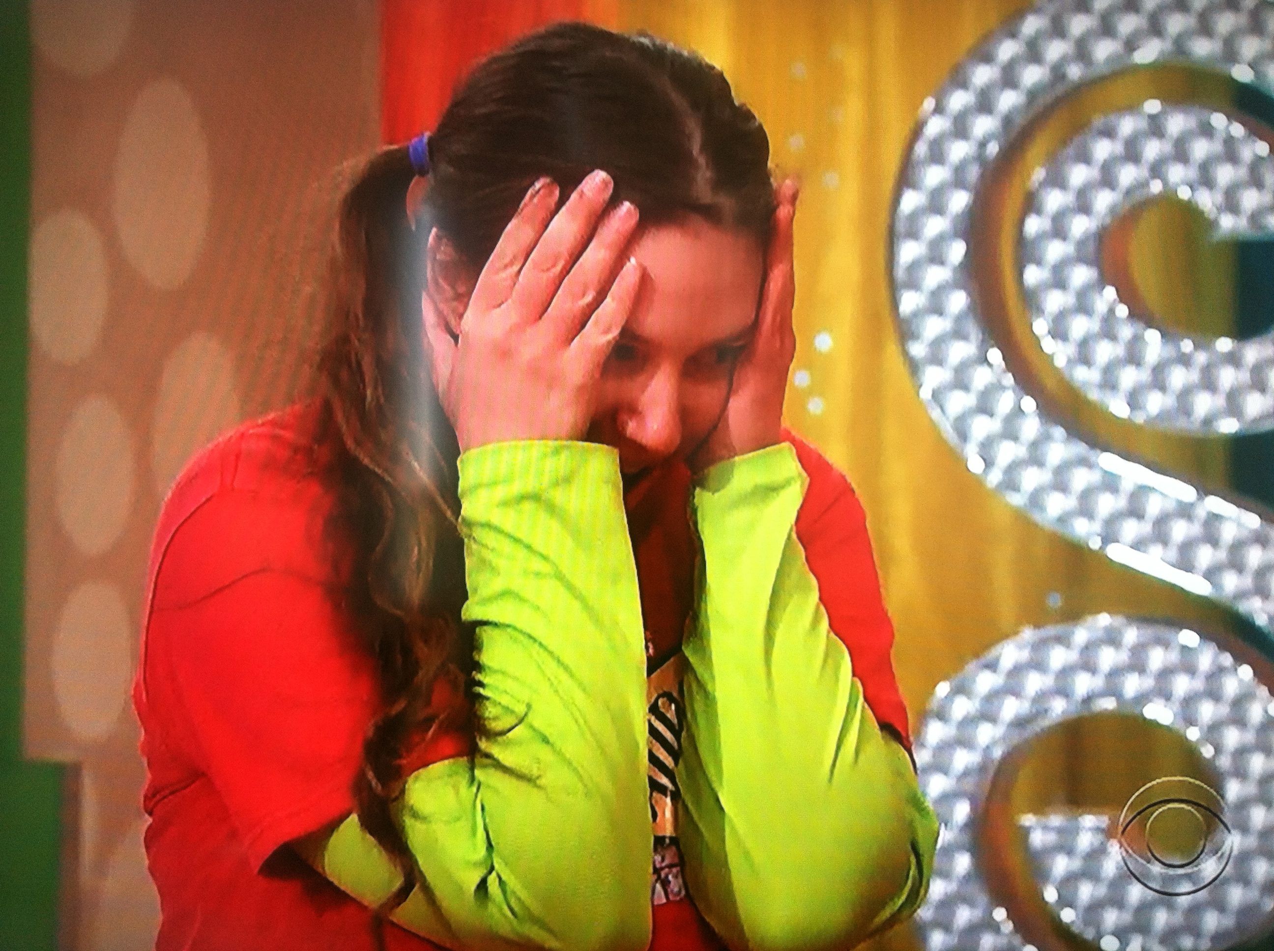 Aurora De Lucia, stressed, head in hands, on The Price is Right after narrowly missing a dollar