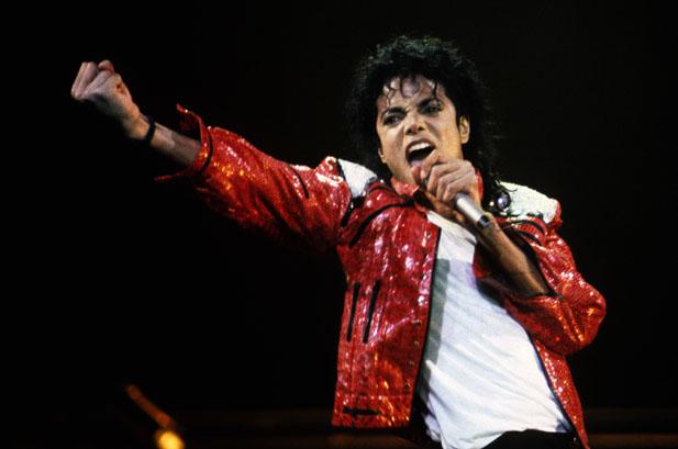 Michael Jackson intense with fist in red leather jacket