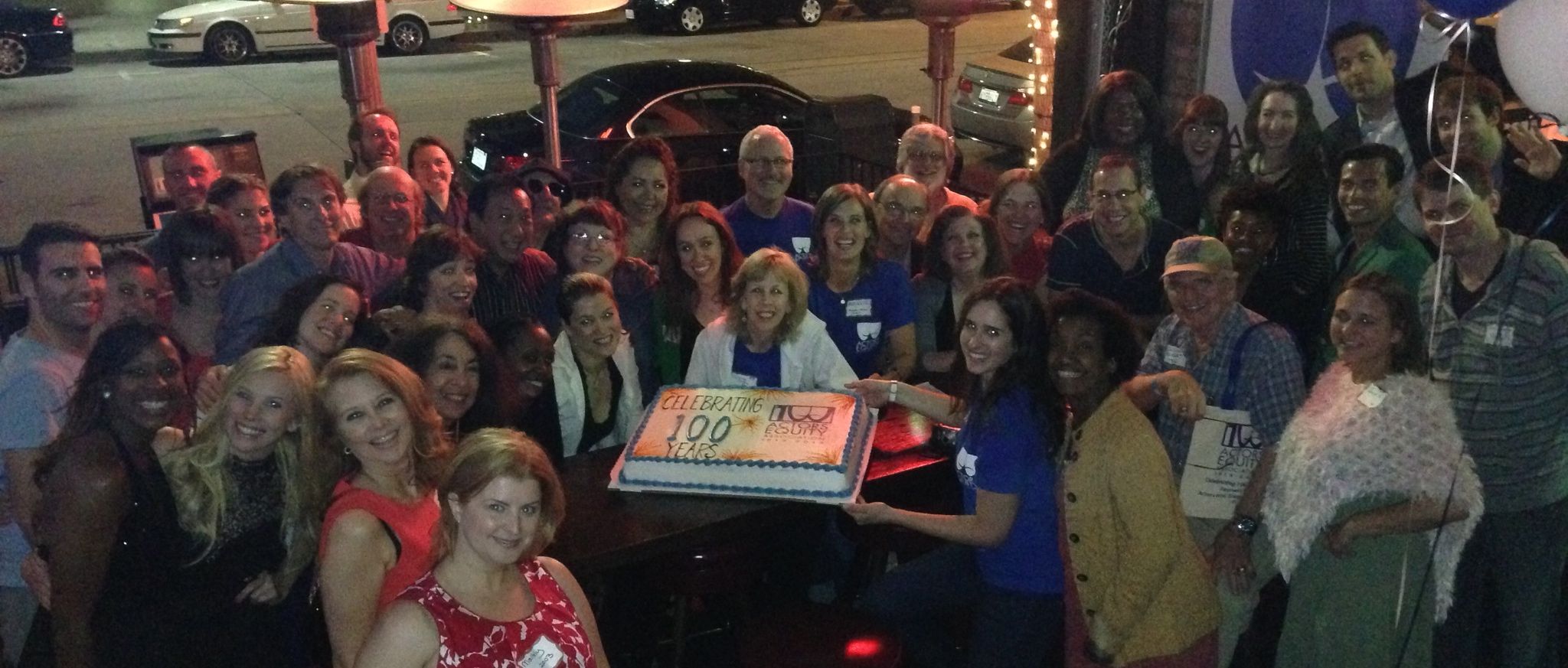 big group celebrating Equity's 100th anniversary