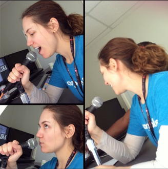 Aurora making voiceover faces into a microphone