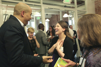 Aurora De Lucia smiling so large while meeting Cory Booker