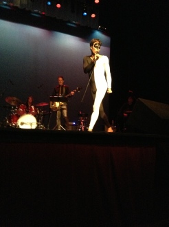 Erik McCormack performing in concert, dressed as Freddie Mercury