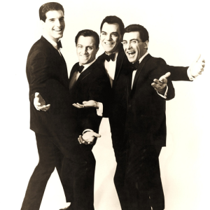 Frankie Valli and the Four Seasons posing together
