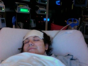Aurora De Lucia lying in bed immediately after open-heart surgery