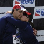 Aurora kissing her dad on the cheek at the Indianapolis Mini Marathon 2012