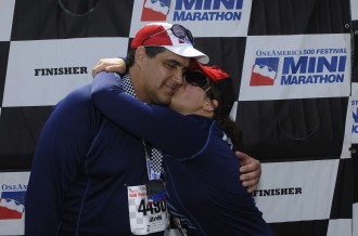 Aurora kissing her dad on the cheek at the finish of the Indianapolis Mini Marathon 2012