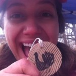 Aurora smiling with her wooden Wittle Waddle medal at the 2012 half marathon