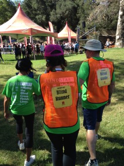 Aurora with a "blind runner" sign on her back before the Lake Irvine obstacle course mud run