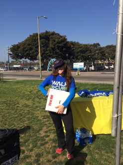 Aurora standing with a first aid kit at the Walk to Cure Arthritis Los Angeles 2014