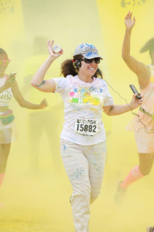 Aurora De Lucia running through yellow coloring at Color Me Rad