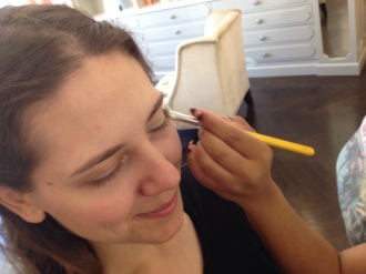 close-up of Aurora getting her make-up done at Blushington before the Creative Arts Emmys