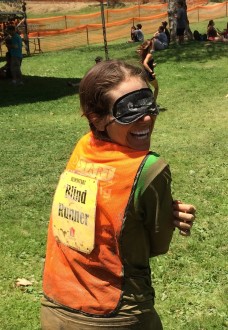 Aurora complete in her muddy clothes and orange blind runner vest with blindfold after the Irvine Lake Obstacle Course run 2014