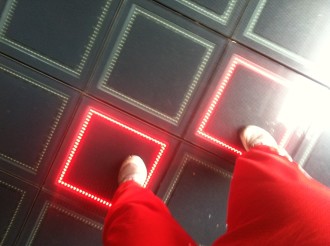 feet dancing on the Billie-Jean-like light up squares outside the Met Lofts