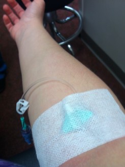 Aurora's arm with an IV inserted for contrast