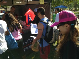 Aurora in line to pick up her race packet at the Irvine Lake Mud Run Obstacle Course 2014