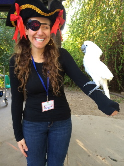 Aurora in a pirate costume holding a live bird