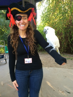 Aurora nervously posing with a bird at Kidspace Children's Museum