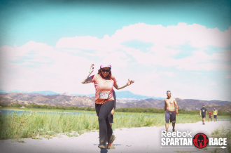 Aurora De Lucia running and smiling at the Spartan Beast in Temecula, CA