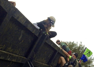 Aurora climbing over a wall at Spartan Ohio trifecta-in-a-day 2014