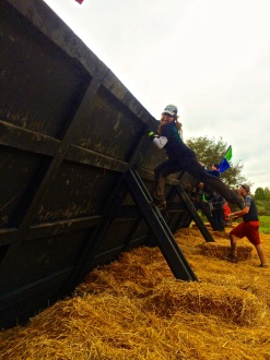 Aurora hanging off the back of the wall at Spartan Beast 2014