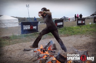 Aurora jumping over fire at the Spartan Ohio Trifecta-in-a-day 2014