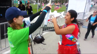 Aurora presending a medal to Gia at the Long Beach 5k 2014