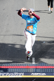 Aurora De Lucia jumping across the finish line of Rock 'n' Roll Los Angeles 2014 (dressed as Mo'ne Davis)